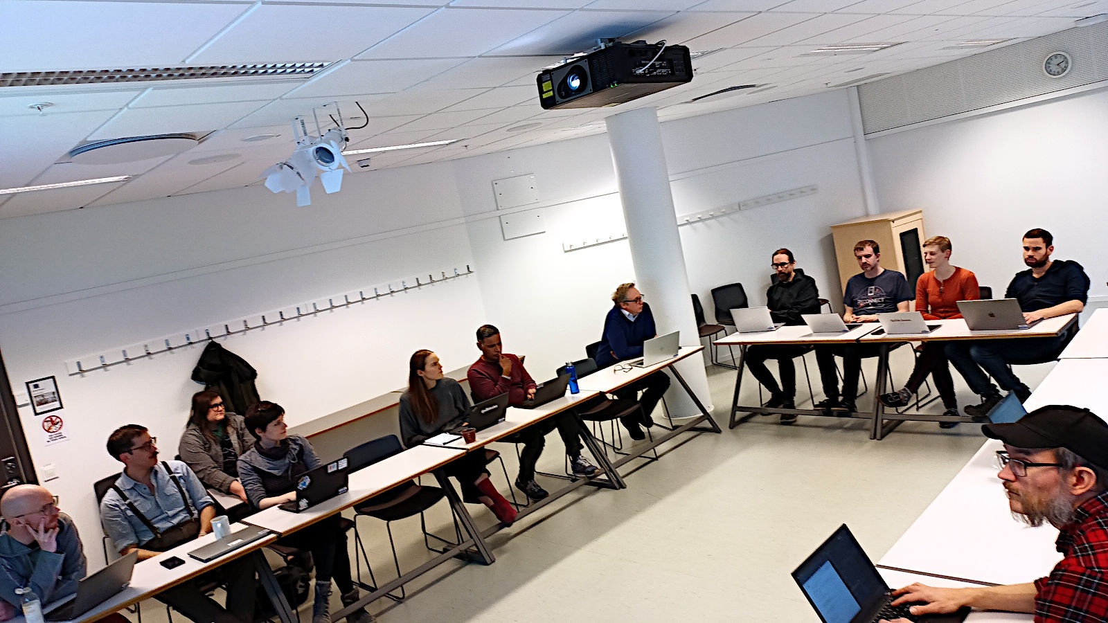 Research engineers sitting in a lecture room.